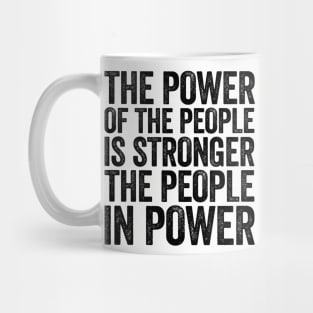 The Power Of The People Is Stronger The People In Power Black Mug